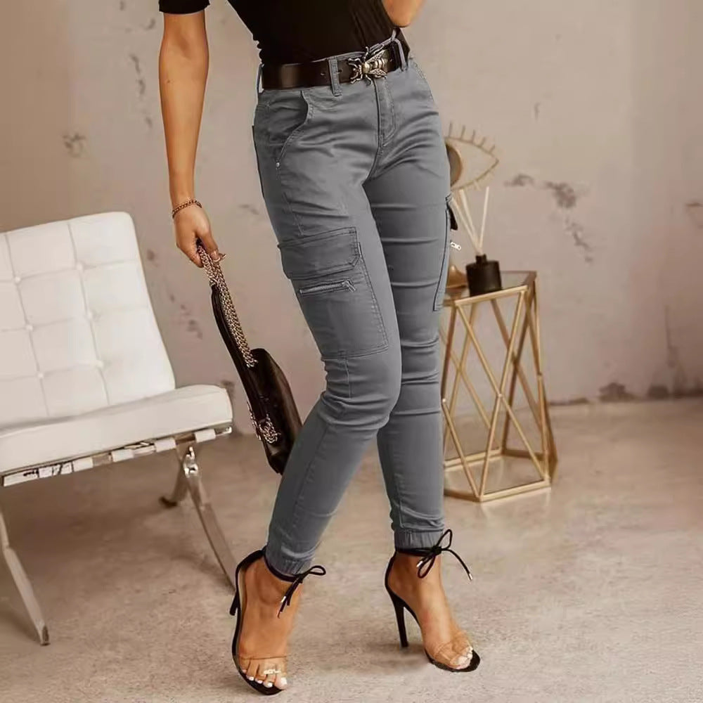 Pantalon taille basse à poches boutonnées de couleur unie pour femme